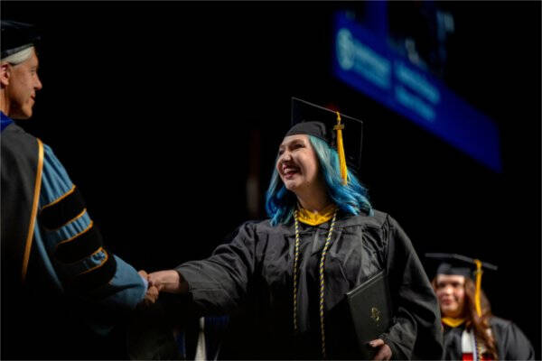 Rachel Conklin accepting diploma